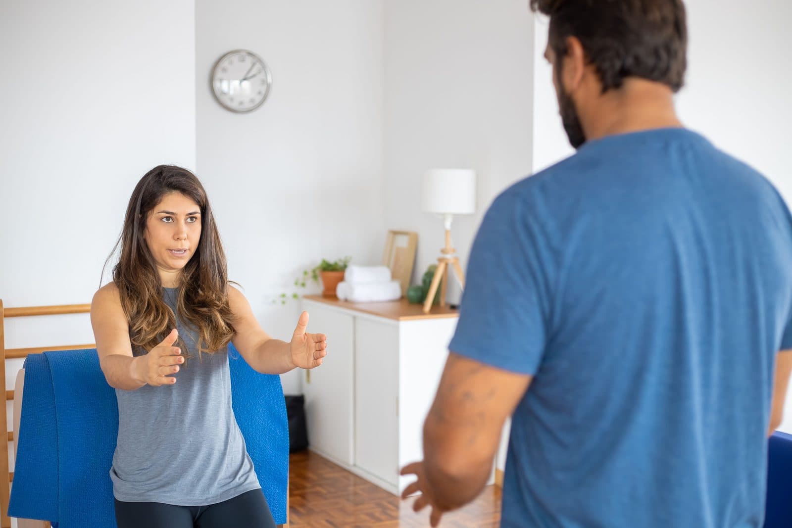 In-home coaching conversation in a bright training space