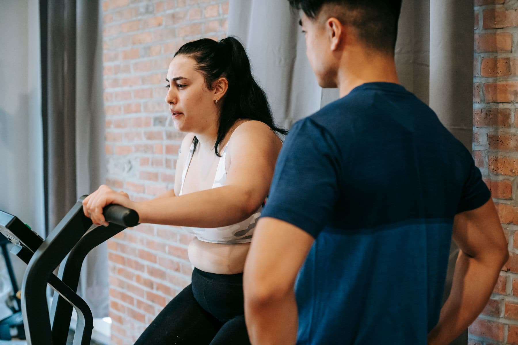 Coach supporting weight-loss-focused training