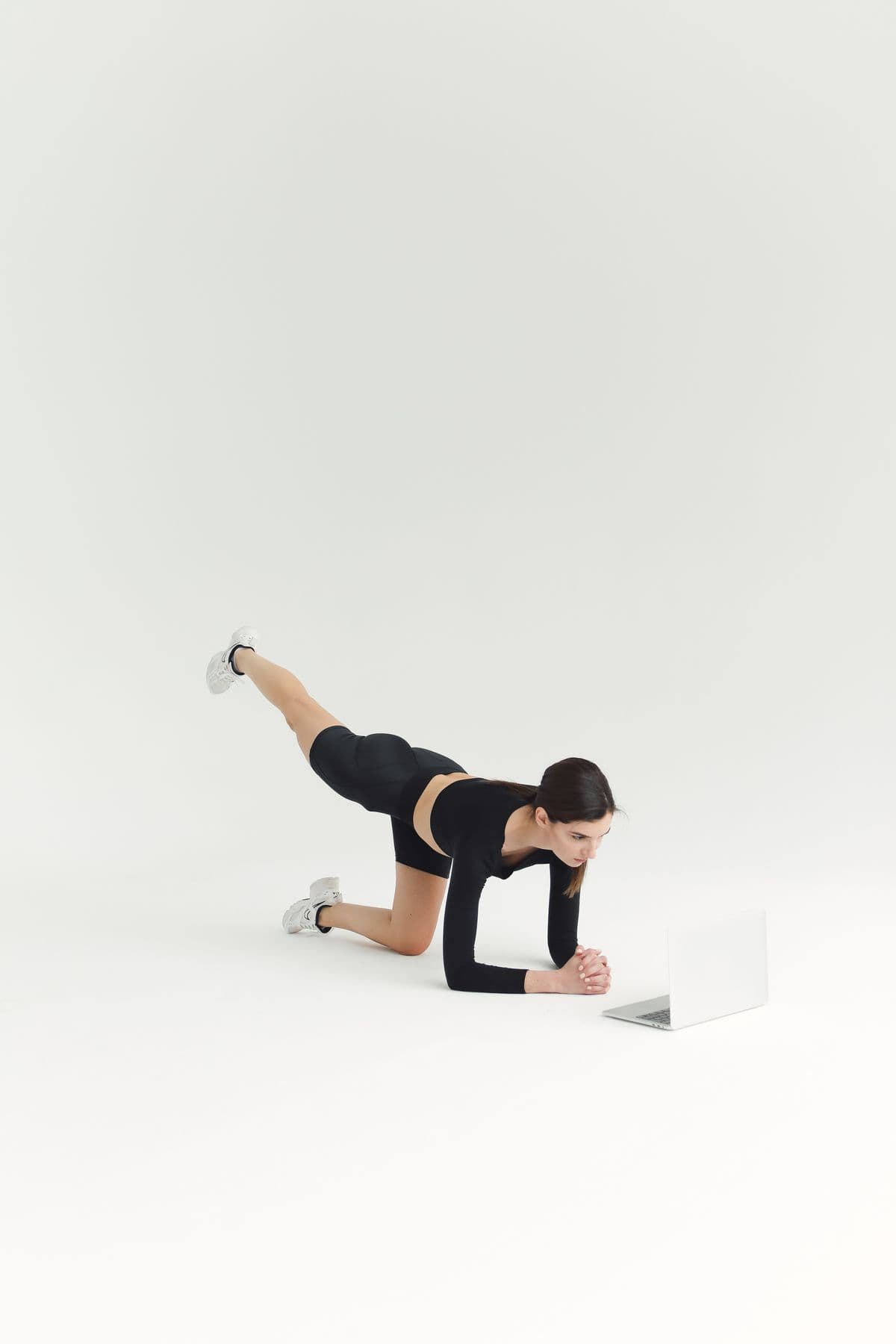 Athlete using a laptop to guide an at-home training session